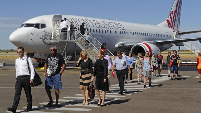 Passengers alight the inaugural Virgin flight in Alice Springs. Picture by Barry Skipsey