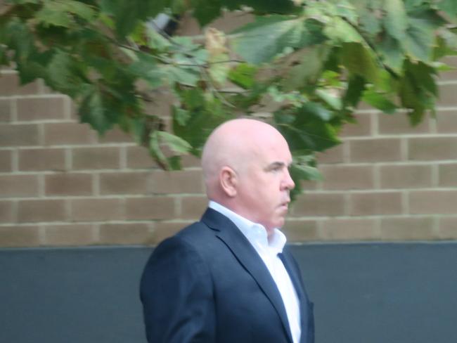 McGrath Terrigal principal Trevor James Hamilton, 50, arriving at Wyong Local Court where he pleaded guilty to intimidation after calling a rival agent and leaving a threatening voicemail. Picture: News Local