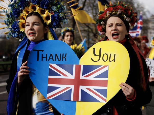 LONDON, ENGLAND - FEBRUARY 24: People with placards and Ukrainian flags participate in a march to mark 2 years since the beginning of the Russian invasion of Ukraine on February 24, 2024 in London, United Kingdom. Entering its third year, Russia's unyielding war on Ukraine has raised concerns about how long Western countries will continue providing weapons and other support to Kyiv. The supply of ammunition, arms, and manpower is now a critical factor in a conflict that has claimed over half a million casualties, and caused the widespread displacement of civilians.  (Photo by Dan Kitwood/Getty Images) *** BESTPIX ***