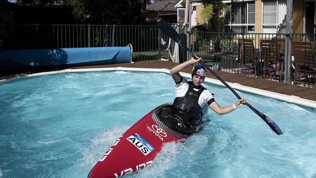 Australian Olympic Canoeist Jess Fox trains in her swimming pool at her home, as athletes across the globe train in isolation under strict policies in place due to the Covid-19 pandemic. Picture: Ryan Pierse/Getty Images.