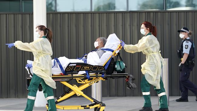 One of the passengers from the second mercy flight to land in Adelaide. Picture: Mike Burton/AAP