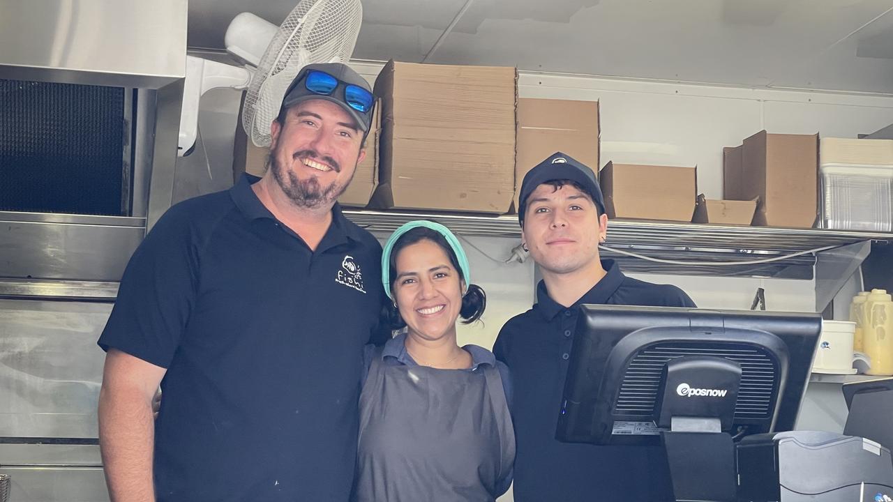 Callum Patience, Val Sanchez and Enzo Sebastiani were the first employees to man the businesses fish and chips van. Photo: Fergus Gregg