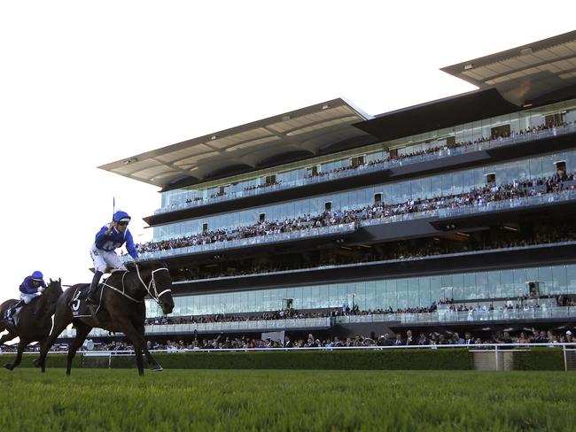 Hugh Bowman (left) raises his whip as Winx takes out the premier event on the opening day of The Championships. Picture: AAP