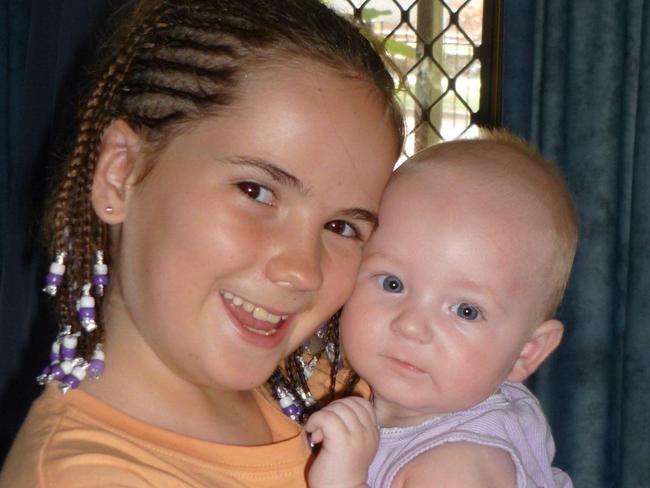 A young Brittany Haste with baby brother James.