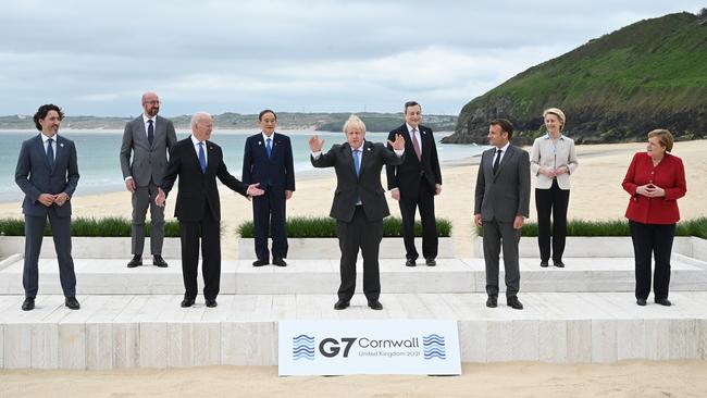 Canadian Prime Minister Justin Trudeau, European Council president Charles Michel, US President Joe Biden, Japanese Prime Minister Yoshihide Suga, British Prime Minister Boris Johnson, Italian Prime Minister Mario Draghi, French President Emmanuel Macron, European Commission president Ursula von der Leyen and German Chancellor Angela Merkel pose for the official family photo during the G7 Summit in Carbis Bay, in Cornwall. Picture: Getty Images