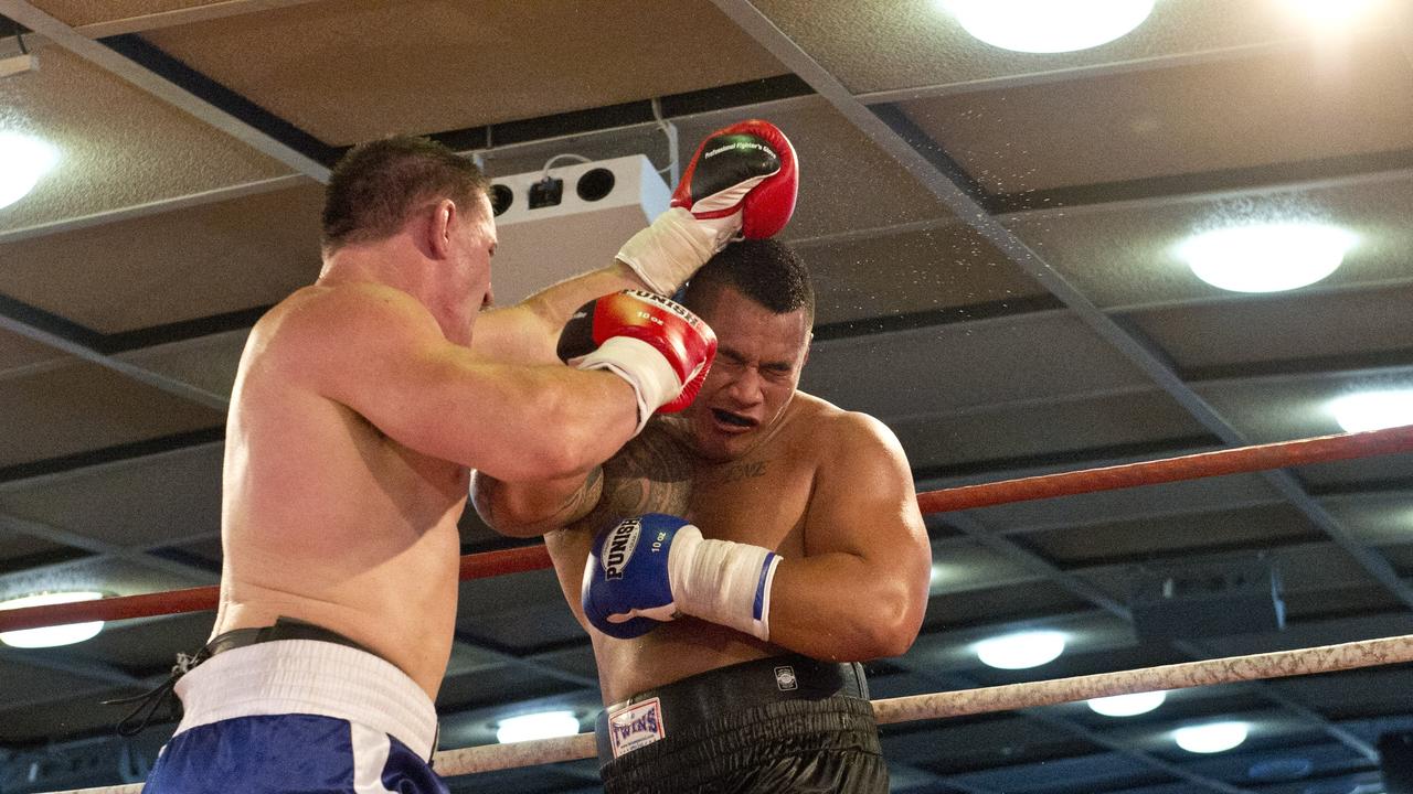 Paul Gallen and Herman Ene-Purcell fight it out in Toowoomba. Friday, Jan 29, 2016.