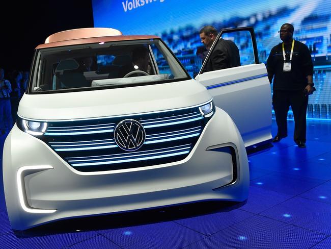 LAS VEGAS, NV - JANUARY 05: Attendees look at the Volkswagen BUDD-e, a long distance electric vehicle, displayed during a press event at CES 2016 at The Chelsea at The Cosmopolitan of Las Vegas on January 5, 2016 in Las Vegas, Nevada.ÊCES, the world's largest annual consumer technology trade show, runs from January 6-9 and is expected to feature 3,600 exhibitors showing off their latest products and services to more than 150,000 attendees. David Becker/Getty Images/AFP == FOR NEWSPAPERS, INTERNET, TELCOS & TELEVISION USE ONLY ==