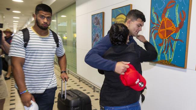 David Fifita’s mum gives him a hug as he arrives at Brisbane International Airport. Picture: AAP Image/Glenn Hunt