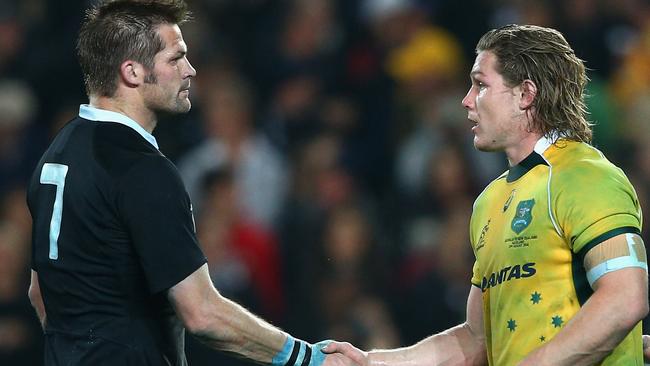 AUCKLAND, NEW ZEALAND - AUGUST 23: All Blacks captain Richie McCaw shakes hands with Wallabies captain Michael Hooper after winning The Rugby Championship match between the New Zealand All Blacks and the Australian Wallabies at Eden Park on August 23, 2014 in Auckland, New Zealand. (Photo by Cameron Spencer/Getty Images)