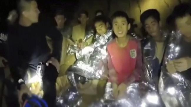 FILE - In this July 3, 2018, file image taken from video provided by the Thai Navy Seal, Thai boys are with Navy SEALs inside a cave in Mae Sai, northern Thailand. The day-to-day pearls of wisdom imparted by coaches to players _ from little league, to high school, to college and even the pros _ are rarely all that groundbreaking: Try your hardest, don't lose focus, support your teammates, keep your chin up. In the case of 12 youth soccer players trapped in a cave in Thailand, it helped save their lives. Unsure of their prospects for more than two weeks while they awaited rescue from a waterlogged cave, the group of kids and their coach found themselves in a life-and-death struggle that placed an acute focus on the value of teamwork, positive attitude and strong leadership. (Thai Navy Seal via AP, File)