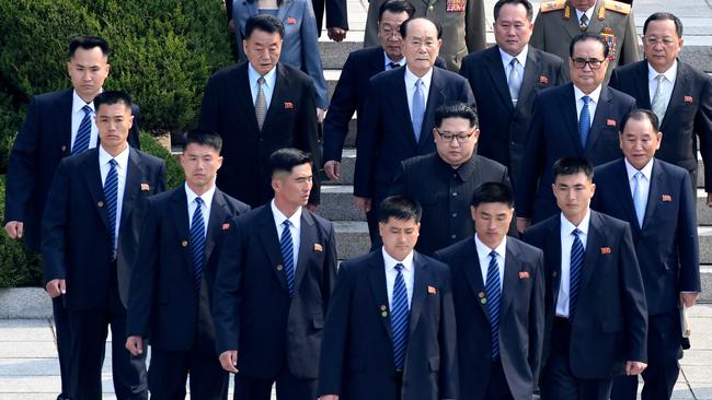 Kim Jong-Un is surrounded by his security guards as he arrives for a meeting with South Korean President Moon Jae-in earlier this year. Picture: AP.