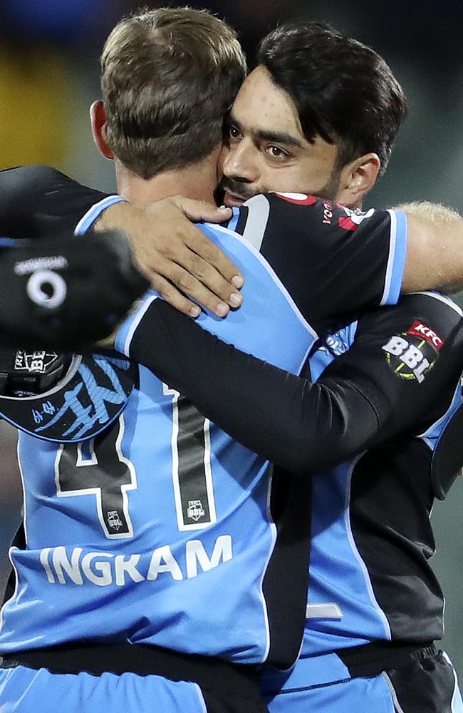 Colin Ingram embraces an emotional Rashid Khan after the Strikers victory. Picture: Sarah Reed