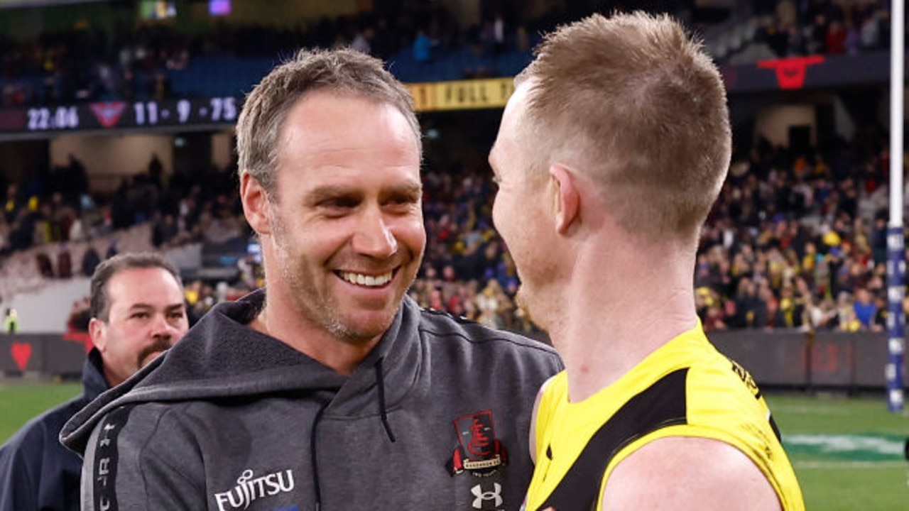 MELBOURNE, AUSTRALIA - AUGUST 20: Ben Rutten, Senior Coach of the Bombers and Jack Riewoldt of the Tigers embrace after the round 23 AFL match between the Essendon Bombers and the Richmond Tigers at Melbourne Cricket Ground on August 20, 2022 in Melbourne, Australia. (Photo by Darrian Traynor/Getty Images)