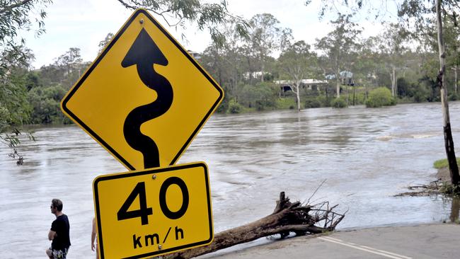 Youngs Crossing Road at Kurwongbah underwater after a flood.