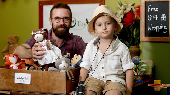 Brad Russell and his son Phoenix 4 at work in the Earth Toys shop in Oceania Walk on Lake St. The State Government has recommended extended trading hours for Cairns CBD on public holidays. PICTURE: ANNA ROGERS