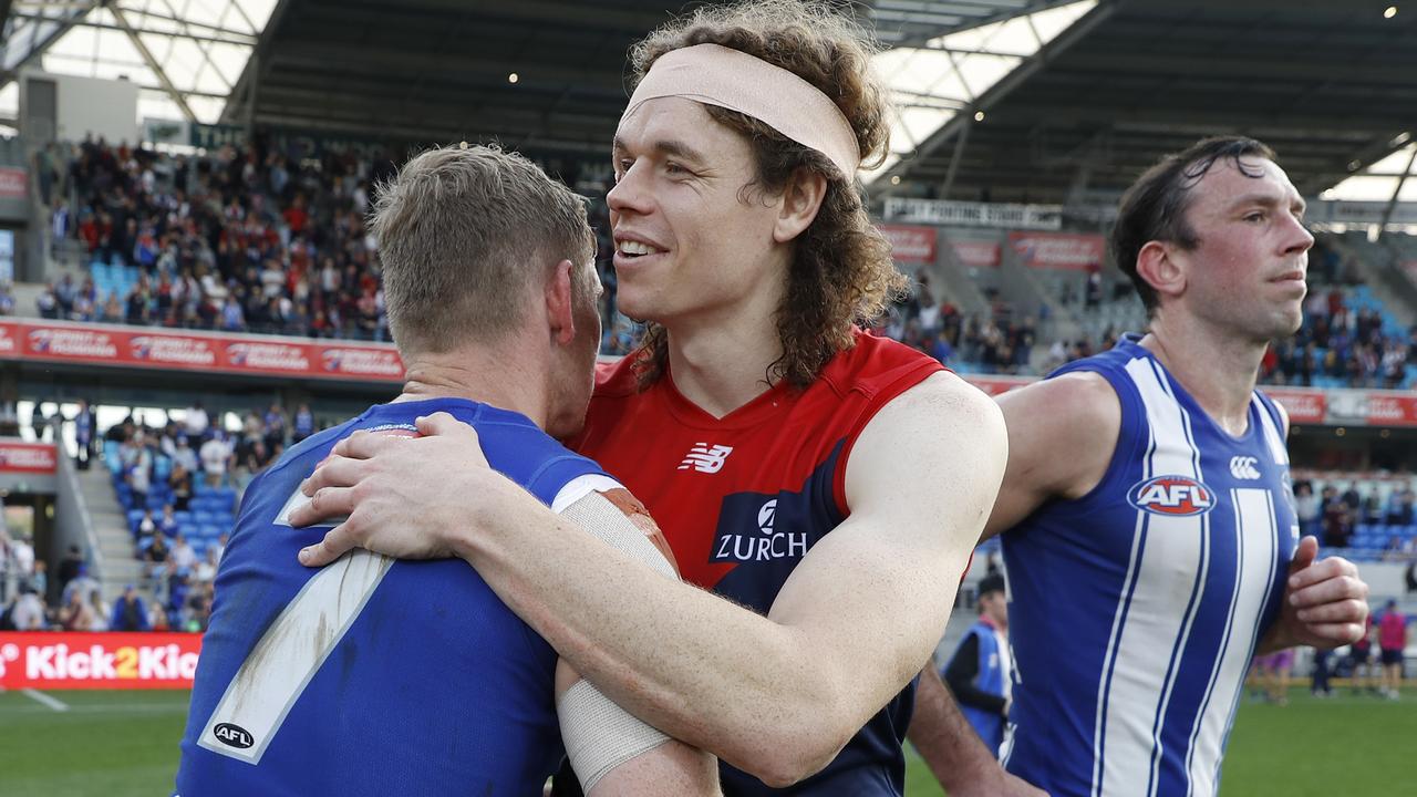 Melbourne recruit Ben Brown shakes hands with former teammate Jack Ziebell.