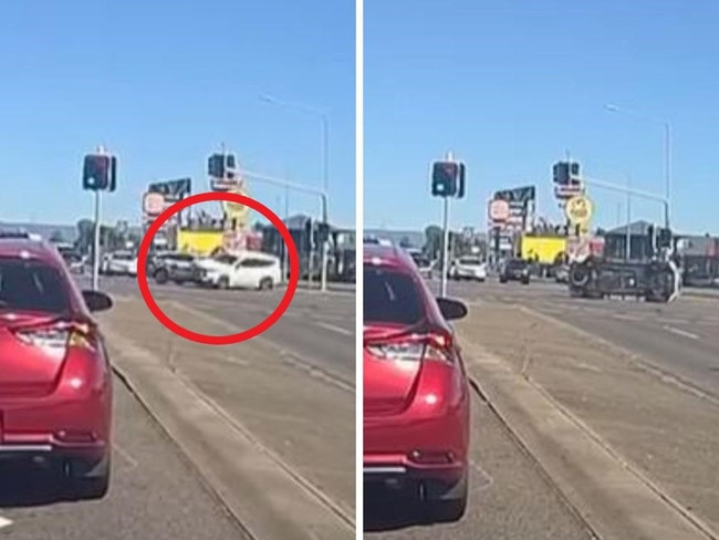 Moment police car with sirens on crashes at intersection.