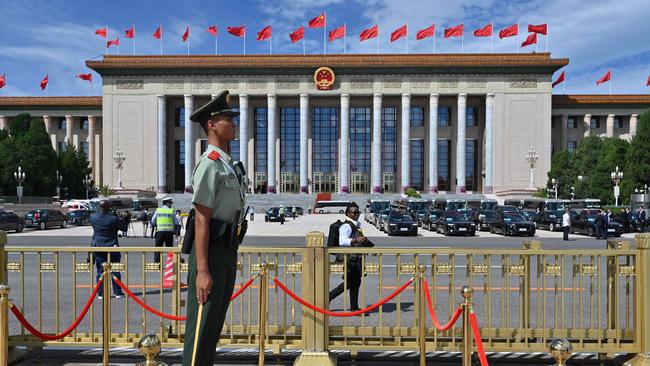 A Chinese paramilitary policeman stands guard outside the Great Hall of the People in Beijing. Picture: AFP