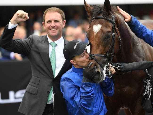 (L-R) Jockey Kerrin McEvoy, trainer Charlie Appleby and strapper Nick Van Eeden are seen after Cross Counter won the Melbourne Cup at Flemington Racecourse in Melbourne, Tuesday, November 6, 2018. (AAP Image/Julian Smith) NO ARCHIVING, EDITORIAL USE ONLY