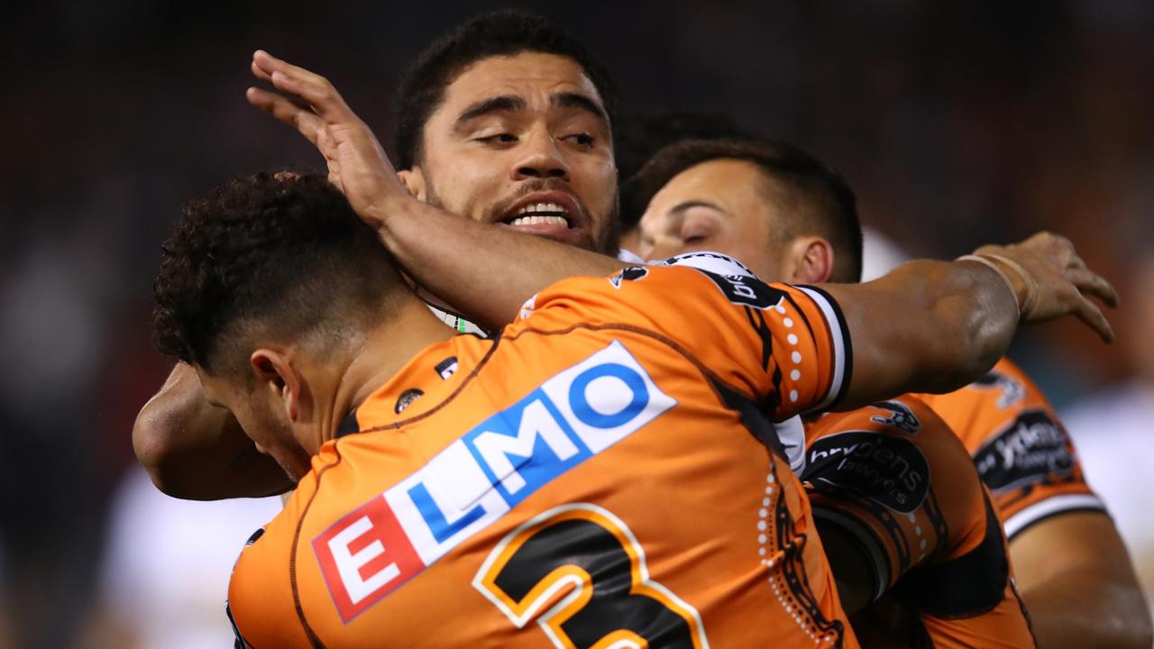 SYDNEY, AUSTRALIA - JULY 09: Isaiah Papali'i of the Eels is tackled during the round 17 NRL match between the Wests Tigers and the Parramatta Eels at Leichhardt Oval on July 09, 2022 in Sydney, Australia. (Photo by Jason McCawley/Getty Images)