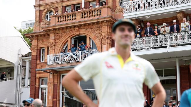 The English cricket team watch over Pat Cummins during the Second Test of the Ashes at Lord’s.