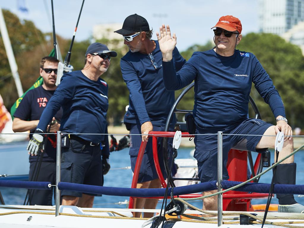 The crew of Maserati wave as they sail from the CYCA during the 2019 Sydney to Hobart on December 26, 2019 in Sydney, Australia. (Photo by Brett Hemmings/Getty Images)