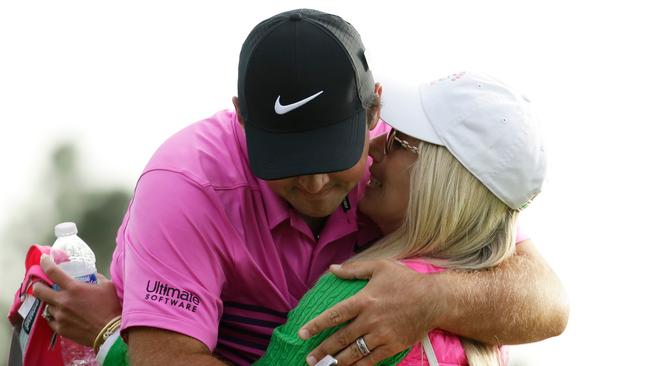 Patrick Reed is hugged by his wife Justine Karain after winning the Masters. Picture: AP.