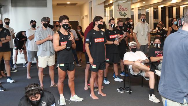 Collingwood players and officials watch the press conference in Melbourne on Tuesday. Picture: Alex Coppel.