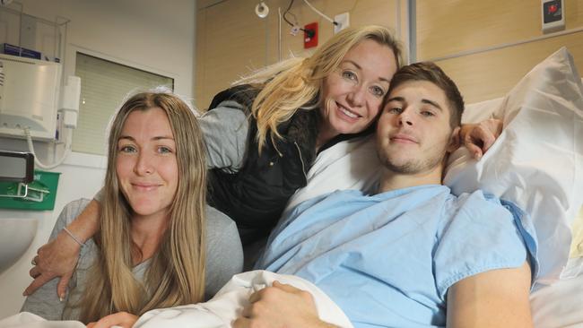 Former Sturt footballer Blake Kennedy in the RAH with mother Michele and sister Amy after damaging his kidney and lung playing against North Adelaide in 2018. Picture: Dean Martin