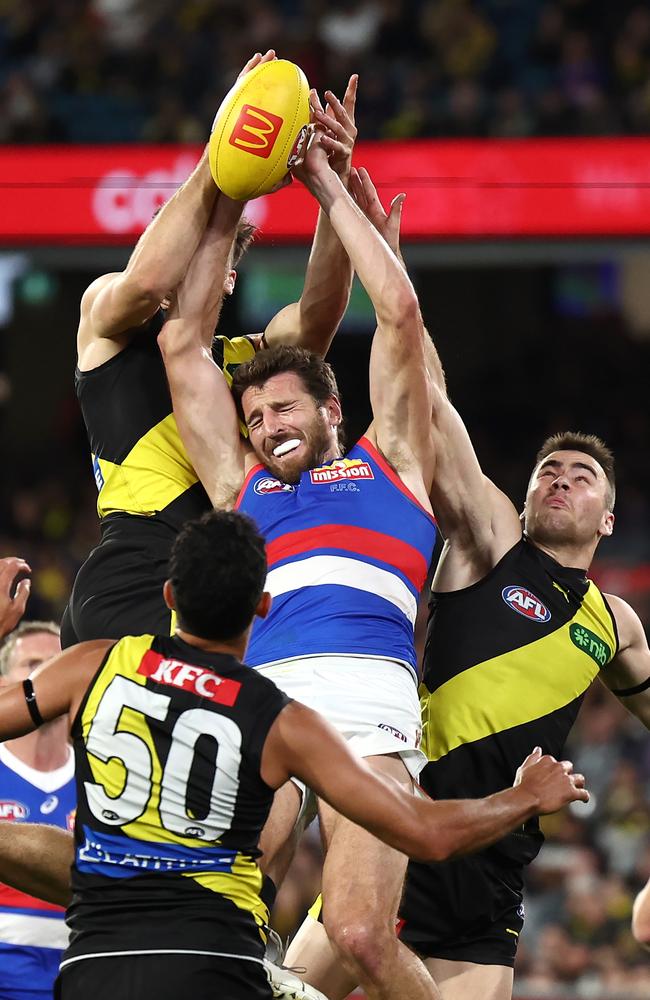 Marcus Bontempelli takes on two Tigers. Picture: Quinn Rooney/Getty Images