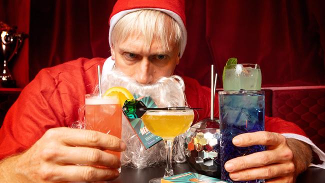 Bad Santa hoarding his drinks and hangover prevention pills. Picture: Mark Stewart