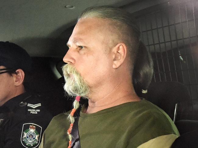 Troy James O'Meara is driven under arrest by police to the Police Watch House in Brisbane, Wednesday, August 22, 2018. Cold case homicide detectives have today arrested a 51 year-old O'Meara for the 1983 murder of Linda Reed on the Gold Coast. (AAP Image/Dave Hunt) NO ARCHIVING