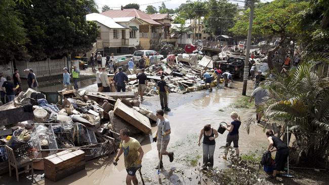 Piles of household goods damaged in the recent flood awaited removal along a street in Brisbane on January 15, 2011 as the city tried to recover from heaving flooding.