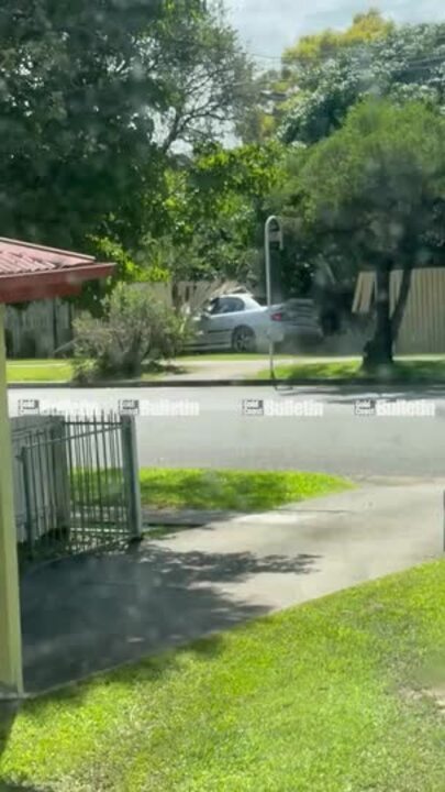 Alleged hoon loses control and crashes through fence on the Gold Coast