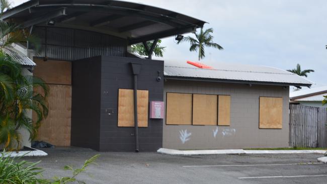 Anglicare NQ has a website outlining facilities and programs at the 40-bed Quigley St night shelter in Cairns – but the facility has been boarded up for some time. Picture: Bronwyn Farr