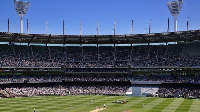 A general view of play as Steve Smith of Australia cover drives during day two of the Boxing Day Test between Australia and India, played at the Melbourne Cricket Ground on Friday, December 27, 2014, in Melbourne, Australia. Picture: Hamish Blair