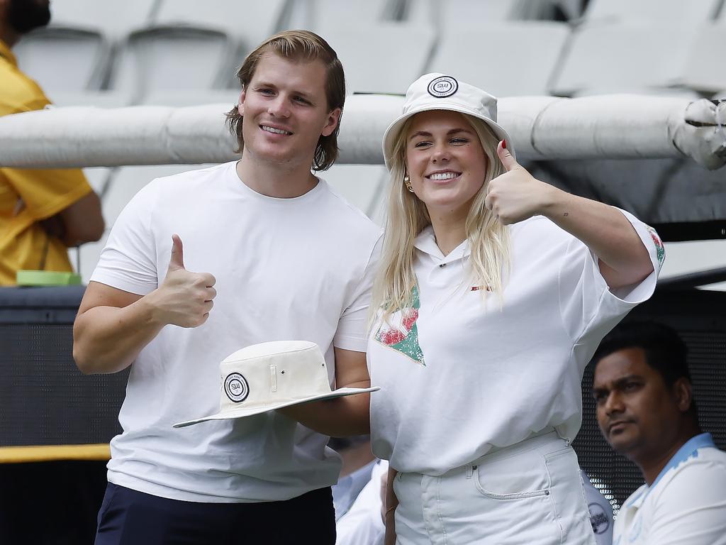 Brooke and Jackson Warne honour their dad Shane Warne on the boundary rope at 3.50pm. Picture: Michael Klein