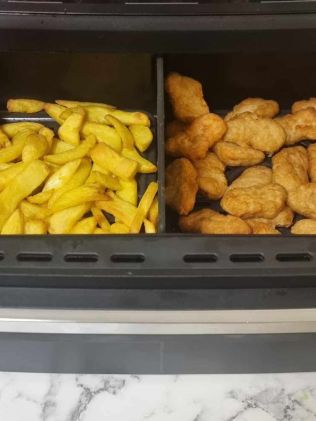 Cooking chips and nuggets at the same time on different settings. Picture: Tahnee-Jae Lopez-Vito/news.com.au.