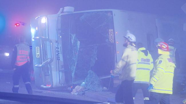 Emergency crews at the horrific bus crash scene. Picture: Carey Harris