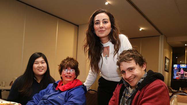 DoSomething Day 2017. Participate Australia clients Ann and Callum with Club Ashfield function manager Natalie Rosalie and Marketing Manager Tijen Salis poses for a photo at Club Ashfield. Club Ashfield put on a free meal for Participate Australia client as part of Do Something Day. (AAP IMAGE/ Danny Aarons)