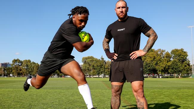 Blessing Sehweah and Nelson Asofa-Solomona promoting Run It straight that pits two competitors against each other who run at full speed and try to hit each other. Picture: Ian Currie