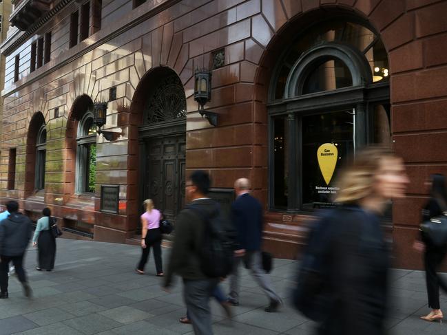 SYDNEY, AUSTRALIA - NOVEMBER 05: Pedestrians walk past the Commonwealth Bank of Australia (CBA) branch at Martin Place on November 05, 2024 in Sydney, Australia. Australia's major banks are set to report record profits this week, with combined cash earnings expected to reach an unprecedented $32.5 billion, marking a 14% increase from the previous year. This surge in profitability is largely attributed to rising interest rates and robust loan growth, despite challenges posed by increased competition and a slowing economy.  (Photo by Lisa Maree Williams/Getty Images)
