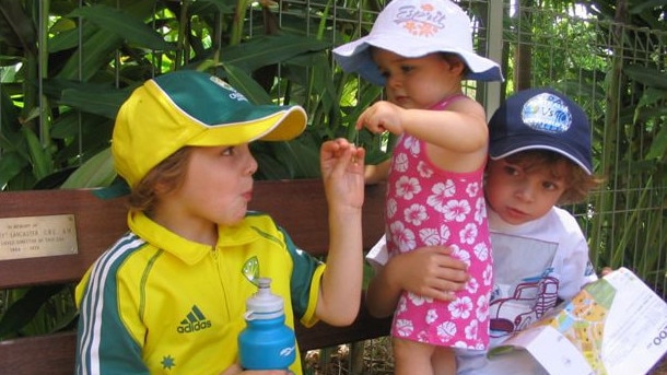 The Kelly twins – Thomas in the Australian colours of yellow and green – as kids with little sister Lucy who is four years younger. Picture supplied by family.