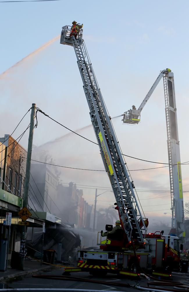 Firefighters battle the blaze. Picture: John Grainger