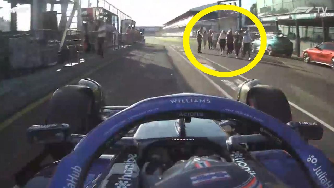 People were in pit lane while Alex Albon was still racing. Pic: Reddit