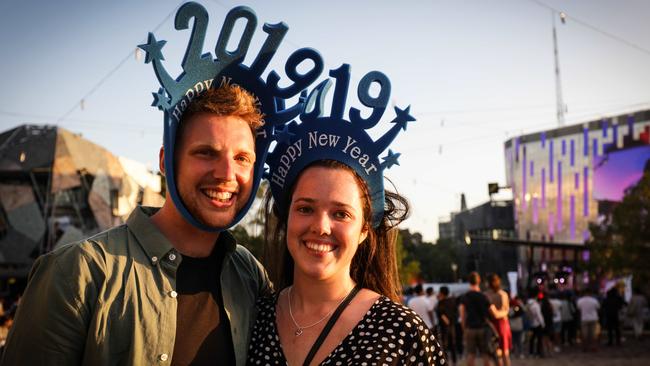 NYE Happy Fun Times. Mount Eliza couple Chloe Harper and Jack Franks celebrate 2019 at Federation Square before heading to Crown.. Picture- Nicole Cleary