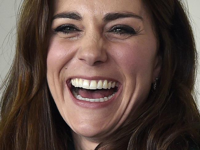 Britain's Kate, the Duchess of Cambridge, laughs, during a visit to St Thomas' Hospital with Prince William to promote mental health issuses, in London, Thursday March 10, 2016. (Toby Melville /Pool Photo via AP)