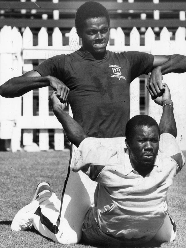 Courtney Walsh, top, and Malcolm Marshall stretch out in 1984