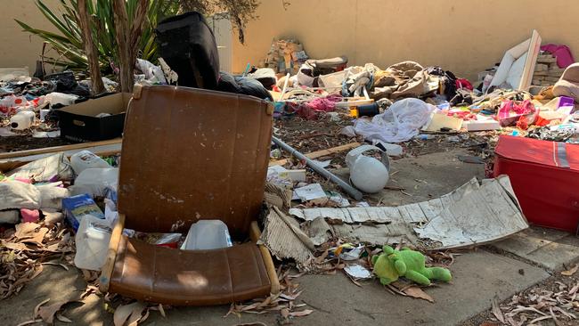 Huge amounts of rubbish and litter outside the Semaphore Park housing trust unit, which hasbeen vacant for months. Picture: Caleb Bond