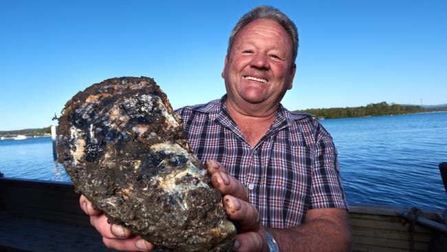 Bernie Connell with the record-breaking Jack, facing the scales today at a foodie festival. Picture: Ben Eyles